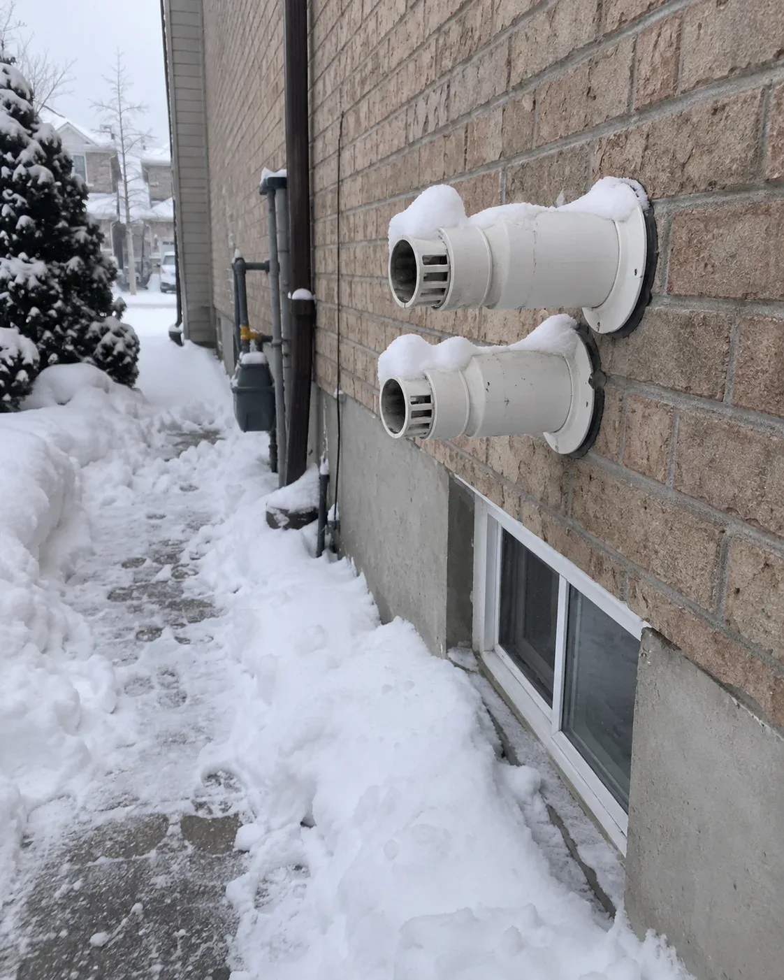 Boiler vent cleared of snow outside an Ottawa home